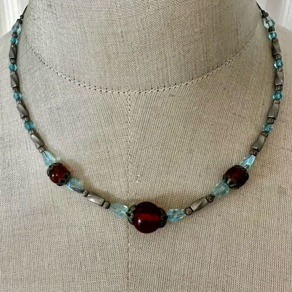Vintage glass bead necklace with orange and aqua blue tones
